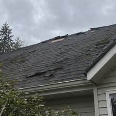 Customer photo: shingles missing near the ridge